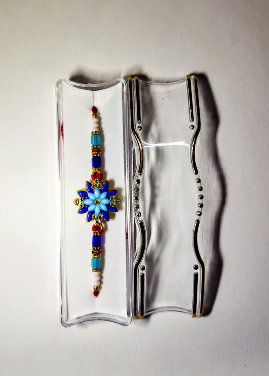 Royal Blue Floral Designer Rakhi – Elegant Handmade Raksha Bandhan Rakhi with Multicolor Beads